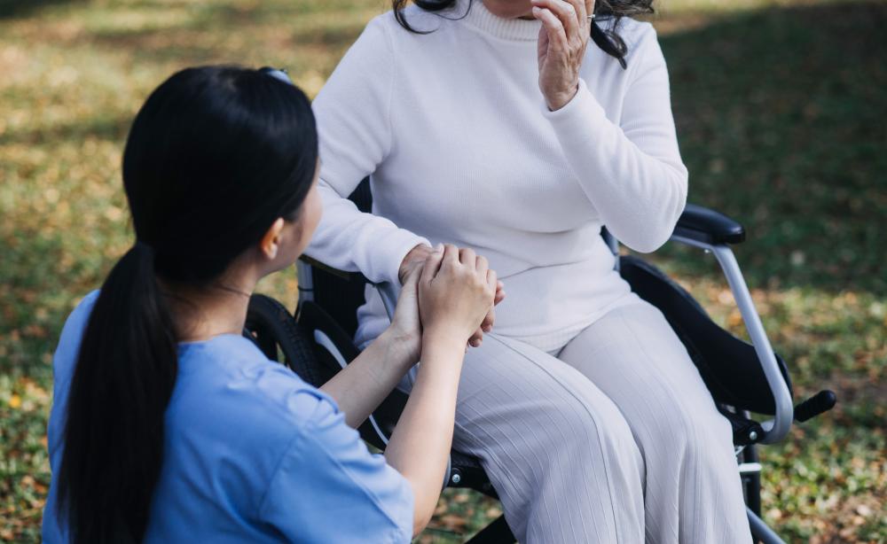 Skilled caregivers sharing a moment of laughter with a patient