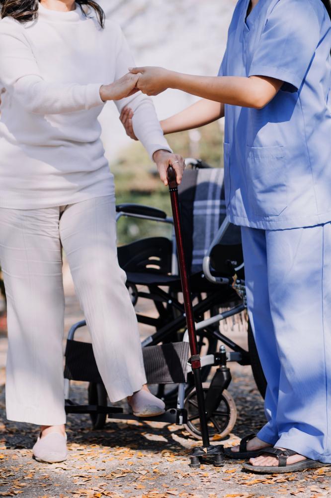 Compassionate nurse caring for disabled senior in Brooklyn home