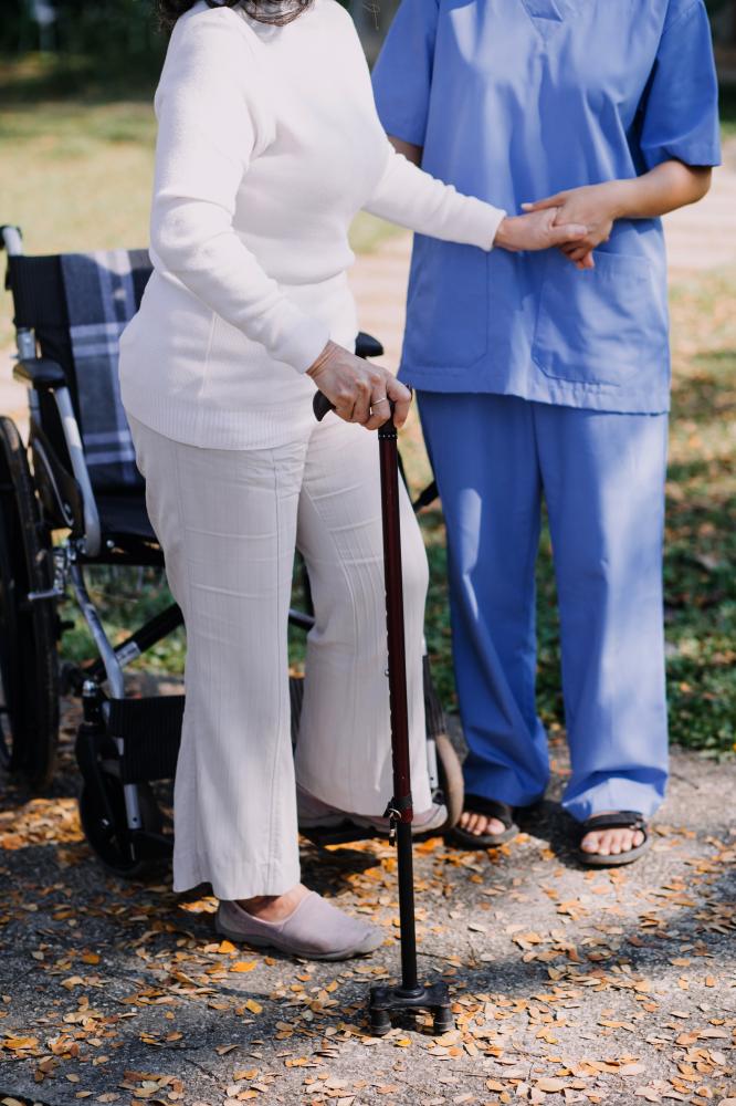 Professional All Heart Homecare nurse supporting a Brooklyn senior