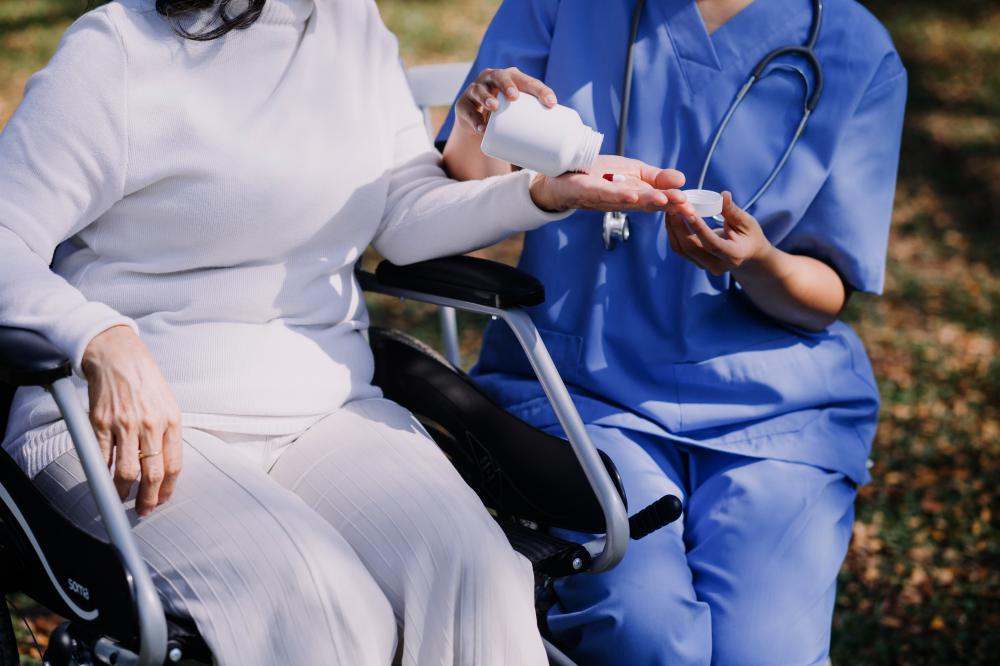 Young nurse providing attentive care in nursing home